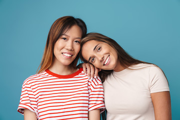 Portrait of multinational young women smiling and looking at camera