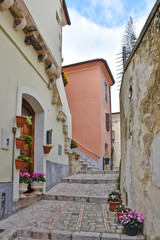 Fototapeta na wymiar Monte San Biagio, Italy, 03/24/2018. A street among the old houses of a village in the Lazio region.