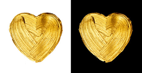 Creative brushstrokes of gold paint isolated on a black background. Gold paint texture. Smears of...