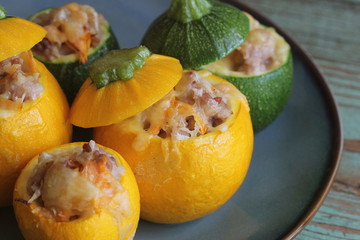 Roasted round zucchini stuffed with minced meat, vegetables, and cheese