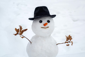 Merry Christmas and Happy Holidays. Winter scene with snowman on white snow background. Happy...