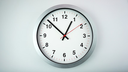 Gray wall clock face beginning of time 12.52 am or pm on White background, Copy space for your text, Time concept..