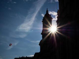 Sun peeping through the bell towers of Rome