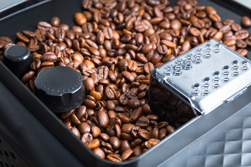 Coffee beans in the automatic coffee grinder