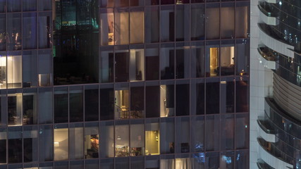 Night view of exterior apartment tower timelapse. High rise skyscraper with blinking lights in windows © HyperlapsePro