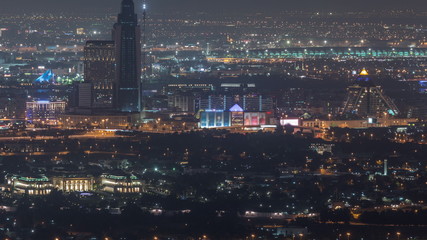 Aerial view of neighbourhood Deira and Dubai creek with typical old and modern buildings night timelapse.