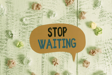 Conceptual hand writing showing Stop Waiting. Concept meaning do not stay in the same place doing nothing Move forward Colored speech bubble paper balls wooden rustic vintage background