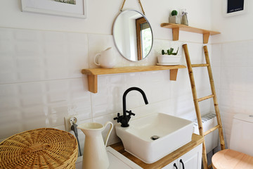 interior of modern small bathroom with wooden decor and white color in vintage style. Small...