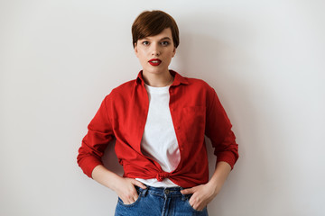 Image of charming brunette woman looking at camera