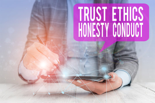 Word writing text Trust Ethics Honesty Conduct. Business photo showcasing connotes positive and virtuous attributes Female human wear formal work suit presenting presentation use smart device