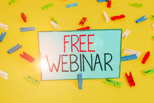 Text sign showing Free Webinar. Business photo showcasing free workshop or seminar that is transmitted over the Web Colored clothespin papers empty reminder yellow floor background office