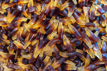 Assorted gummy candies, sweets in shape of bottles . Top view. Sweet background