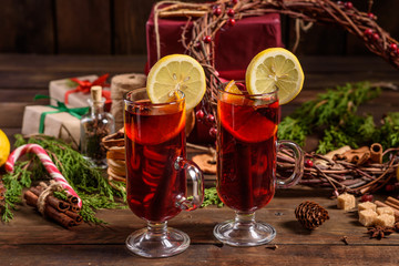 Christmas hot mulled wine with cinnamon cardamom and anise on wooden background