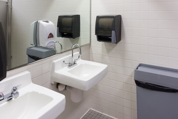 White porcelain sink in public restroom