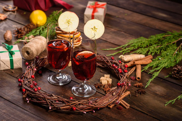 Christmas hot mulled wine with cinnamon cardamom and anise on wooden background