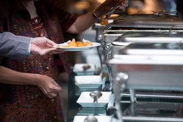people group catering buffet food indoor, with food and beverage,Eat together.