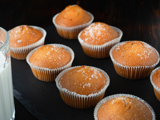 some juicy tasty muffins stuffed cupcakes. dark background
