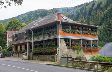 A large beautiful building with many colors on the walls.