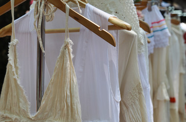 Closeup of female cotton handmade cloths on clothing rack showed  for selling.