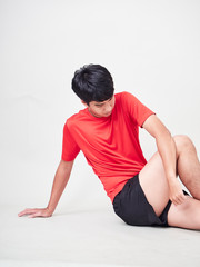 Fototapeta premium Young man sports player stretching and exercising