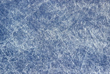 Texture of a blue stone-washed denim fabric