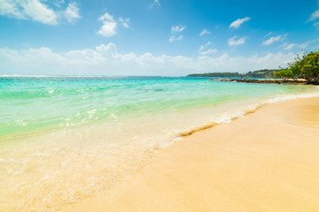 Golden sand and turquoise water in Guadeloupe