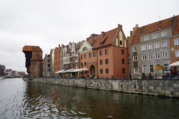 Fototapeta na wymiar Gdansk, Poland - September 2019: view of the central promenade. Urban architecture on the waterfront.