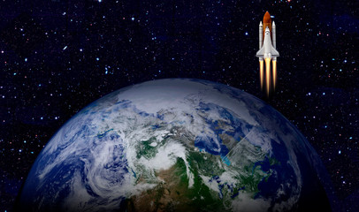 Space shuttle launch in the open space over the Earth. Elements of this image furnished by NASA