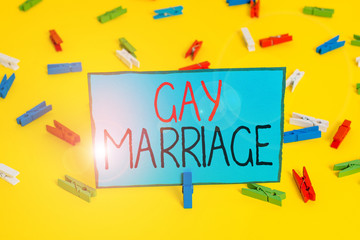 Text sign showing Gay Marriage. Business photo showcasing entered into in a civil or religious ceremony of the same sex Colored clothespin papers empty reminder yellow floor background office