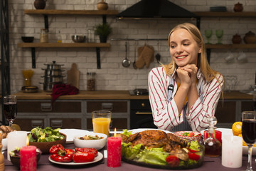 Woman looking at the food in the kitchen