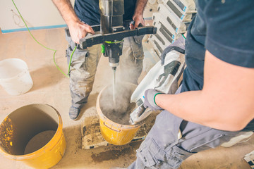 Mix the concrete solution in a bucket with a mixer