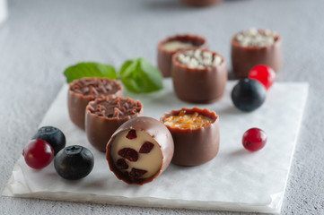 chocolates with different toppings and with mint and berries