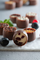 chocolates with different toppings and with mint and berries