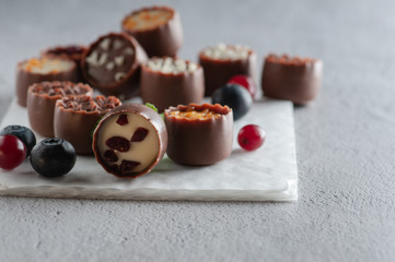 chocolates with different toppings and with mint and berries