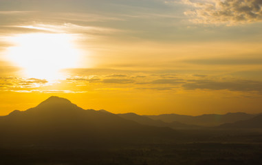 mountain with sunlight gold sky background