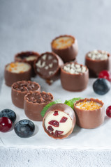 chocolates with different toppings and with mint and berries