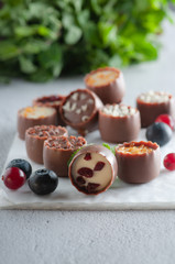 chocolates with different toppings and with mint and berries