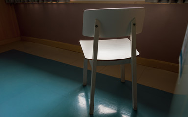 Abstract of White chair with dark background