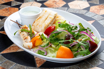 Squid fillet with vegetables in sauce