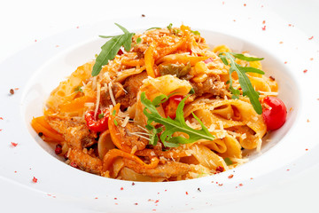 Duck fettuccine with cherry tomatoes in red sauce