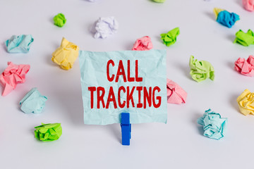 Handwriting text Call Tracking. Conceptual photo Organic search engine Digital advertising Conversion indicator Colored crumpled papers empty reminder white floor background clothespin