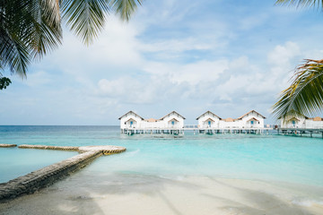 Fototapeta na wymiar Beautiful Landscape of Over ocean Tropical beach summer resort hotel and spa, Maldives island with sea and sky tranquil for holiday vacation