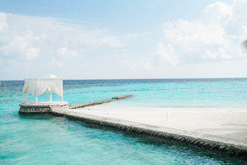 White arch with Beautiful Landscape of Tropical beach summer at resort hotel and spa, Maldives island with sea and sky tranquil for holiday vacation