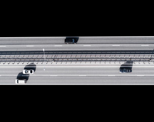 Aerial view of highway in city isolated on black background. Cars crossing interchange overpass....