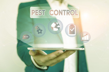 Writing note showing Pest Control. Business concept for analysisagement of a species that impacts adversely on huanalysis Male human wear formal suit presenting using smart device