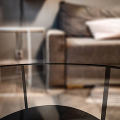 Glass coffee table and autumn home interior. Free space for your decoration. 