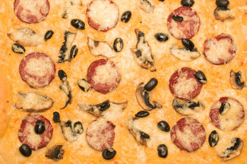 Pizza with sausage close up texture background