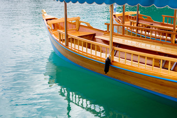 Fototapeta na wymiar Gondola floats in the blue river