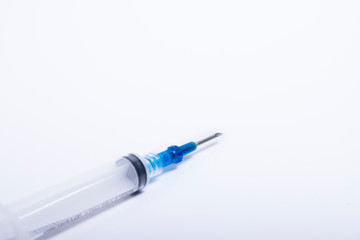 Fototapeta premium Syringes were placed on a white background in a diagonal direction.