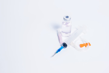 Medical bottle for injection with a syringe on the white background